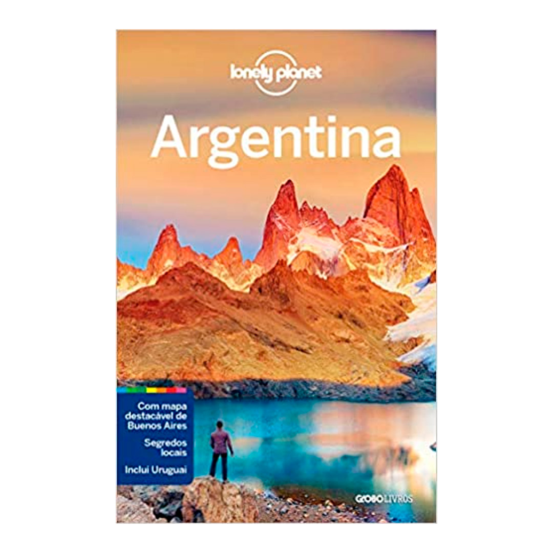 Livro com a capa escrito Argentina e uma paisagem de morros e lago